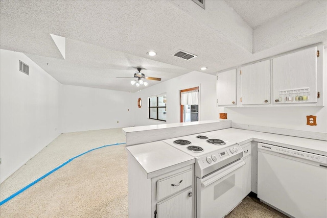 kitchen with ceiling fan, a textured ceiling, white appliances, white cabinetry, and kitchen peninsula