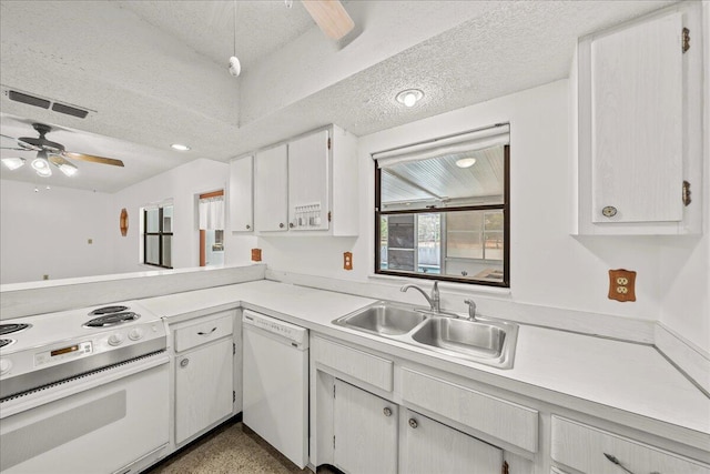 kitchen featuring white cabinets, white appliances, sink, ceiling fan, and a textured ceiling