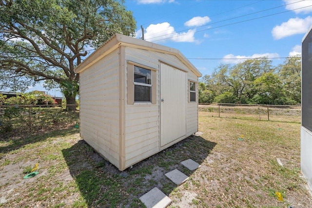 view of outdoor structure with a lawn