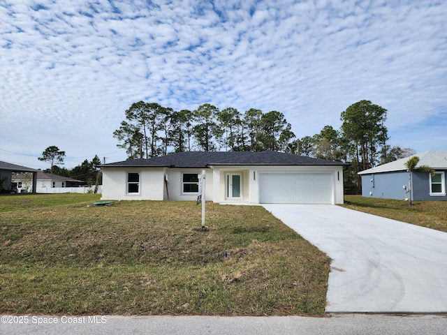 single story home with a garage and a front lawn