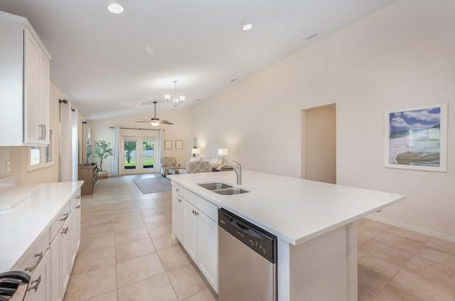 kitchen featuring white cabinets, sink, dishwasher, lofted ceiling, and an island with sink