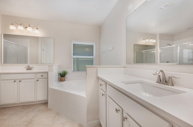 bathroom with tile patterned flooring, vanity, and separate shower and tub