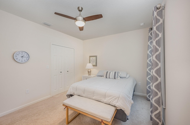 bedroom featuring carpet flooring, ceiling fan, and a closet