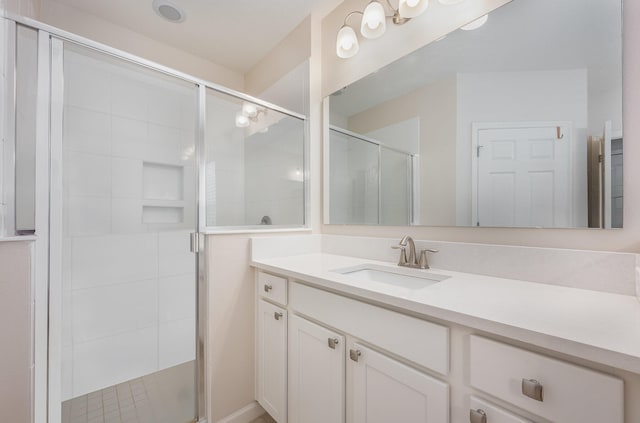 bathroom featuring vanity and walk in shower