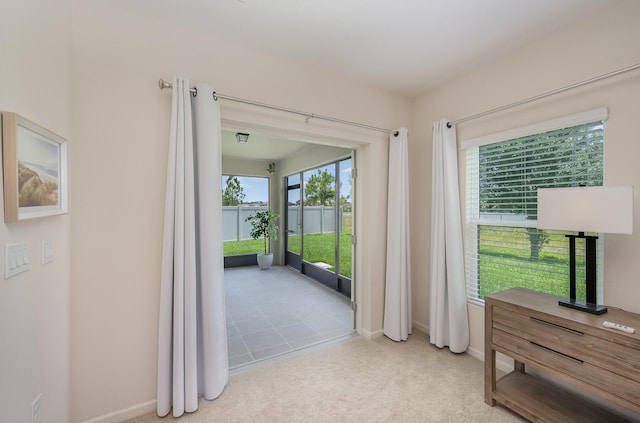 interior space featuring light colored carpet