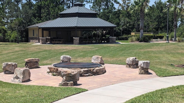 view of yard with a gazebo and an outdoor fire pit