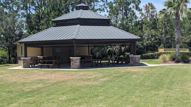 surrounding community featuring a gazebo and a yard