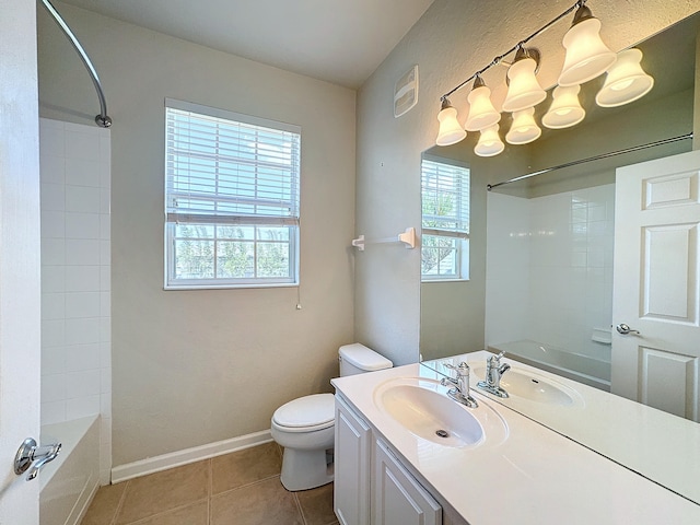 full bathroom featuring vanity, toilet, tile patterned flooring, and tiled shower / bath