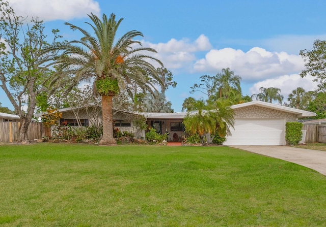 view of front facade with a garage and a front lawn