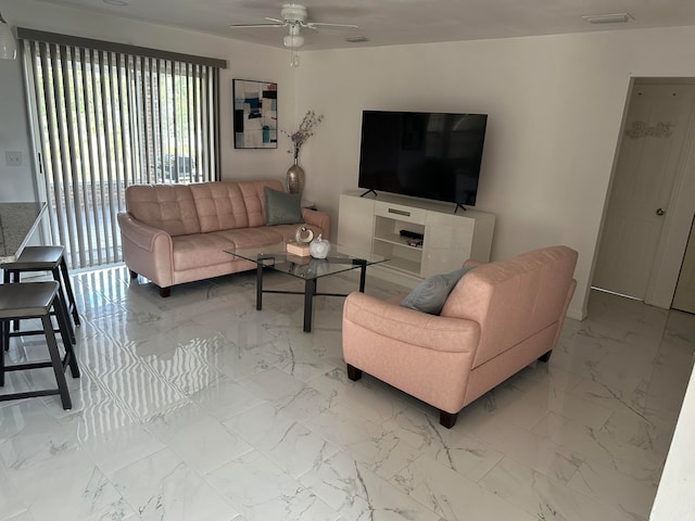 living room featuring ceiling fan and tile flooring