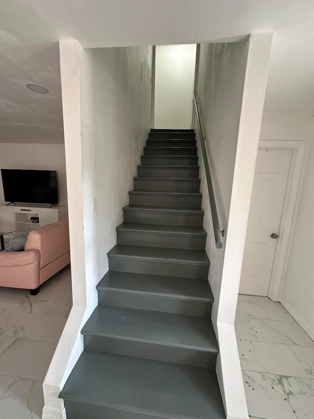 stairway featuring tile flooring