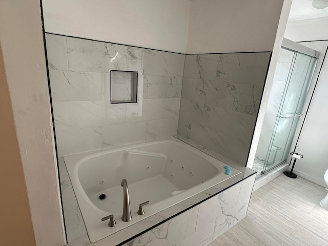 bathroom featuring toilet, tile floors, and independent shower and bath