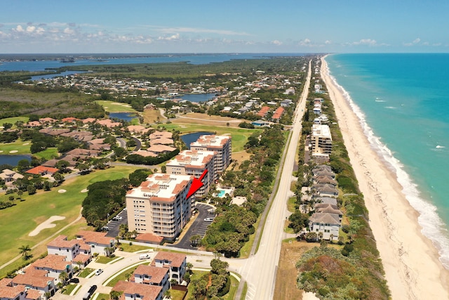 bird's eye view with a water view and a view of the beach