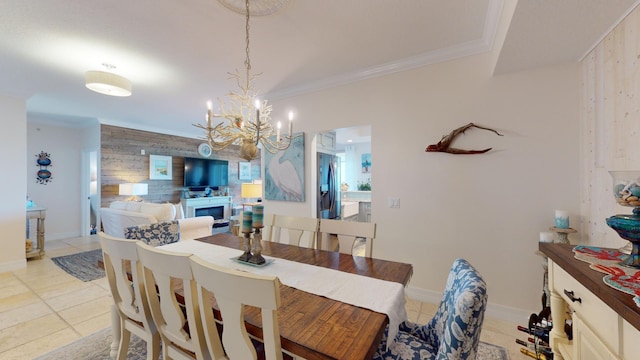 tiled dining space featuring a notable chandelier, wooden walls, and ornamental molding