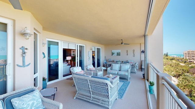 balcony with outdoor lounge area and ceiling fan