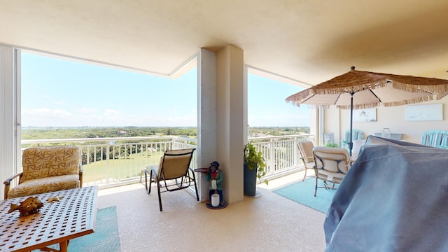 view of patio / terrace with a balcony and a grill