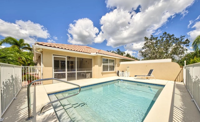 view of swimming pool with a patio