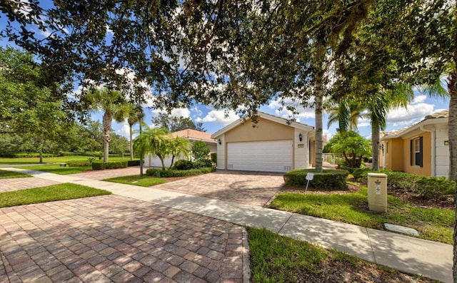 view of front of property with a garage