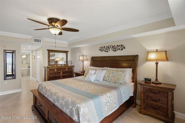 tiled bedroom featuring crown molding, ensuite bath, a raised ceiling, ceiling fan, and a textured ceiling