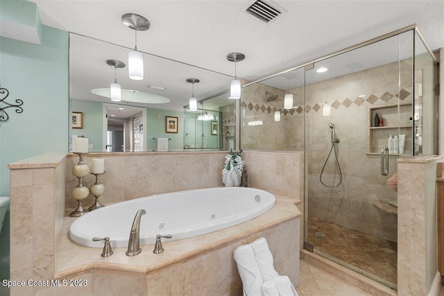 bathroom with tile flooring and plus walk in shower