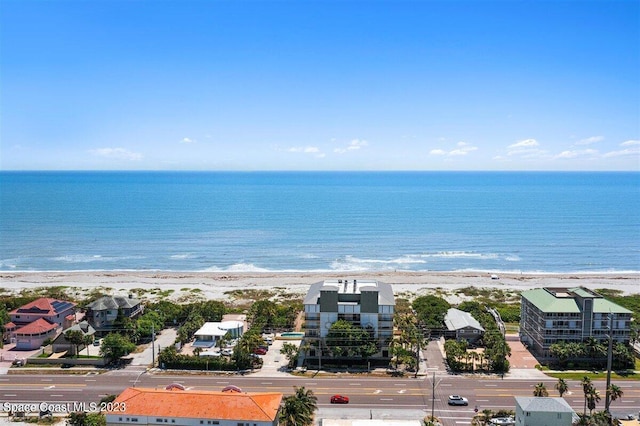 bird's eye view featuring a view of the beach and a water view