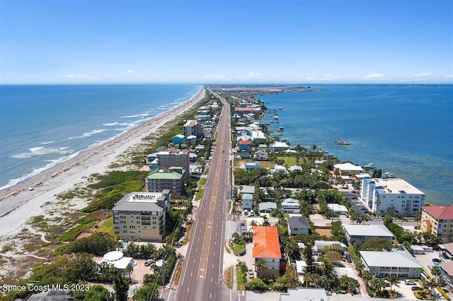 aerial view featuring a view of the beach and a water view