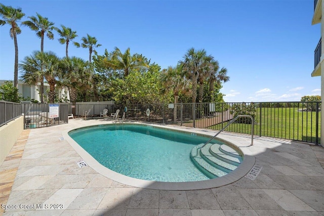 view of swimming pool with a patio area