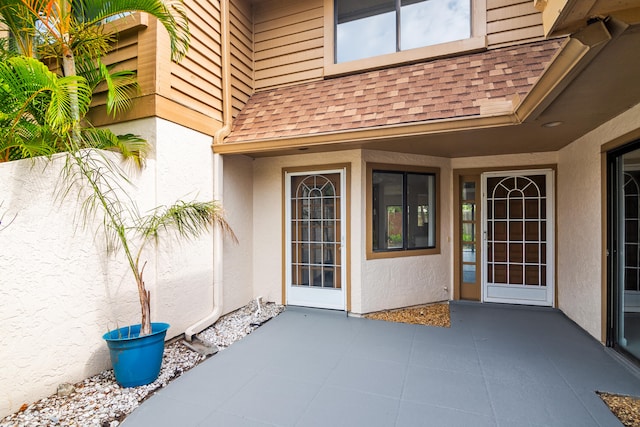 property entrance featuring a patio