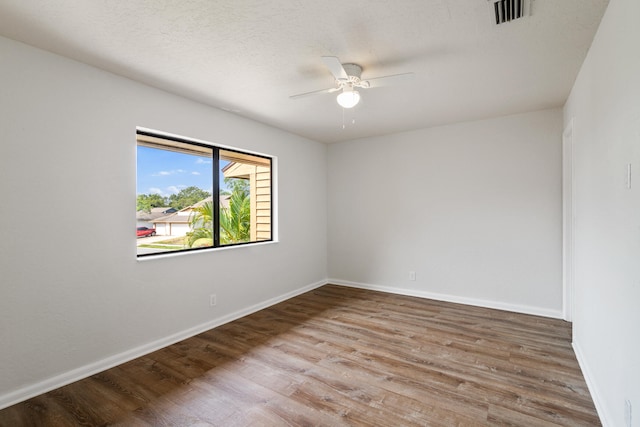 unfurnished room featuring wood-type flooring and ceiling fan