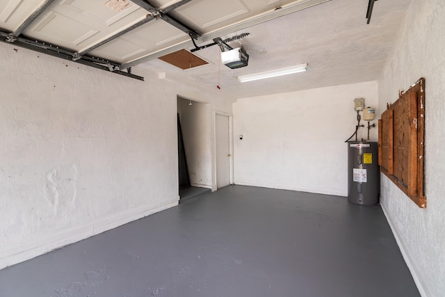 garage with water heater and a garage door opener