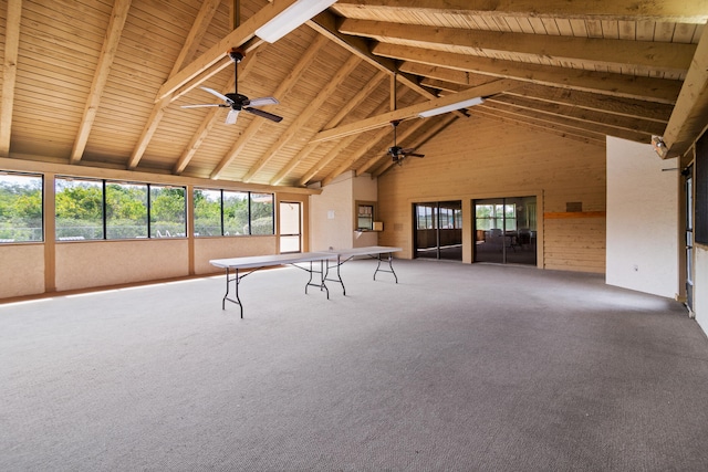 interior space featuring high vaulted ceiling, ceiling fan, beam ceiling, carpet flooring, and wood ceiling