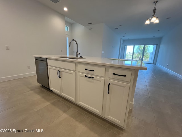 kitchen with sink, dishwasher, a kitchen island with sink, white cabinets, and decorative light fixtures