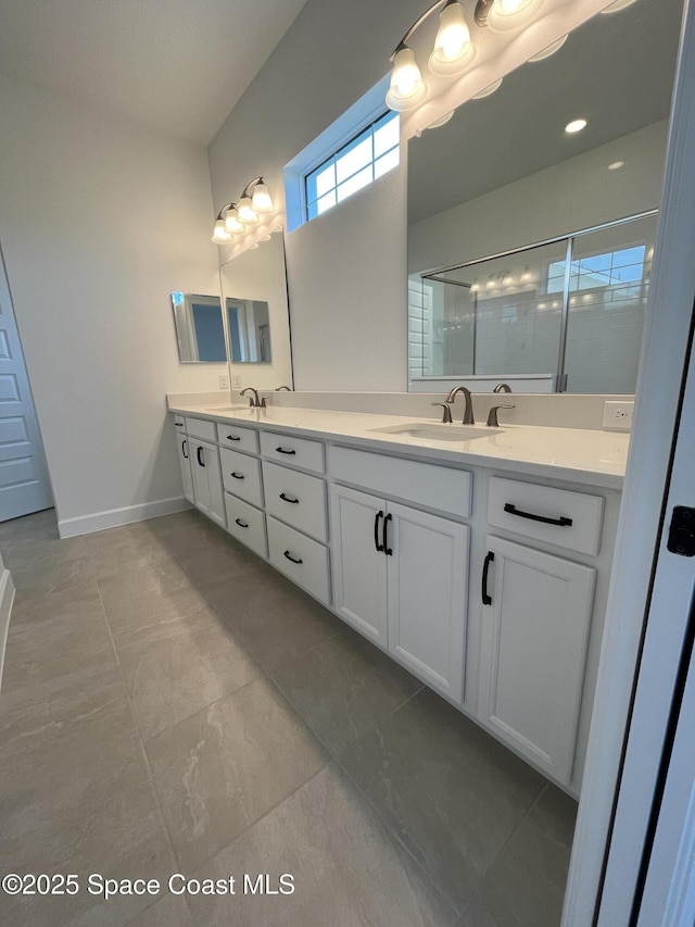 bathroom featuring vanity, an enclosed shower, and tile patterned flooring