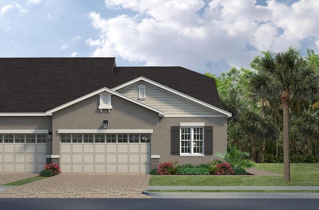 view of front facade with a garage, roof with shingles, decorative driveway, and stucco siding