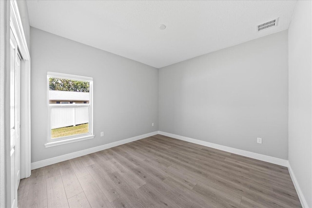 spare room featuring hardwood / wood-style floors