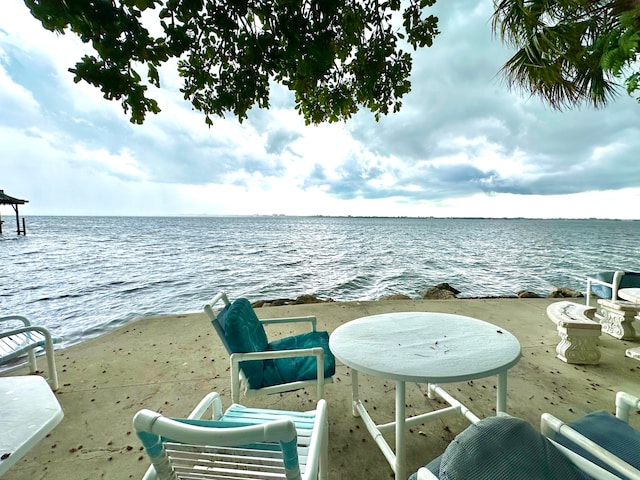 exterior space featuring a patio and a water view