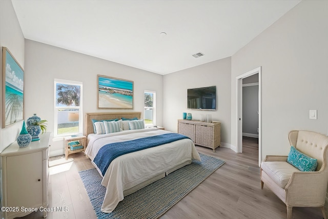 bedroom with light hardwood / wood-style floors