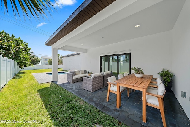 view of patio / terrace featuring a fenced in pool and an outdoor hangout area