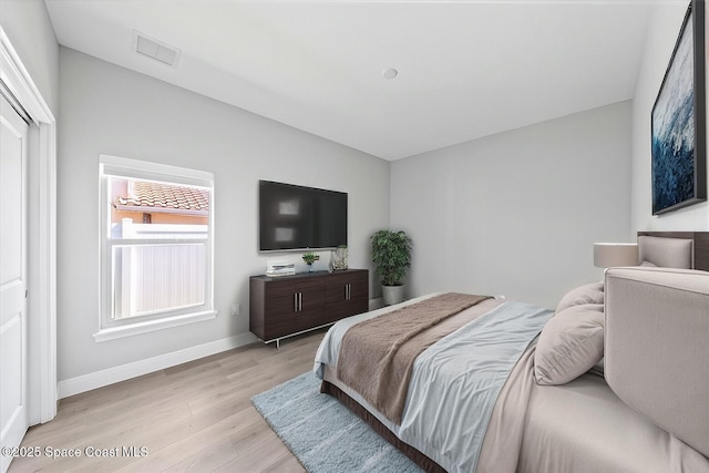 bedroom featuring light hardwood / wood-style floors