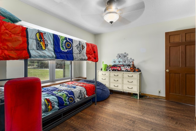 bedroom with ceiling fan and dark hardwood / wood-style flooring