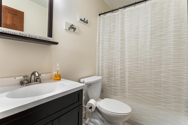 bathroom featuring vanity, a shower with curtain, and toilet