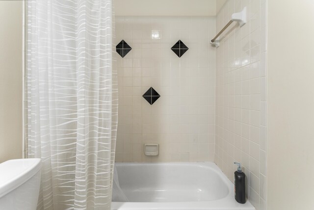 bathroom with shower / bathtub combination with curtain