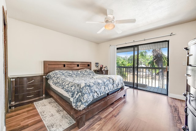 bedroom featuring hardwood / wood-style floors, ceiling fan, and access to exterior