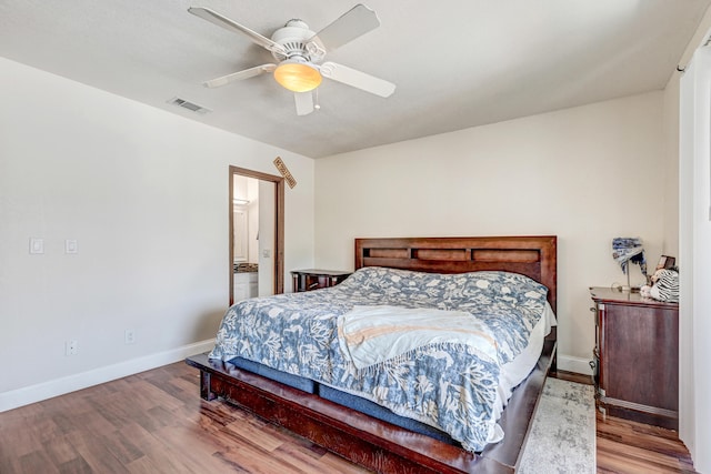 bedroom with wood-type flooring and ceiling fan