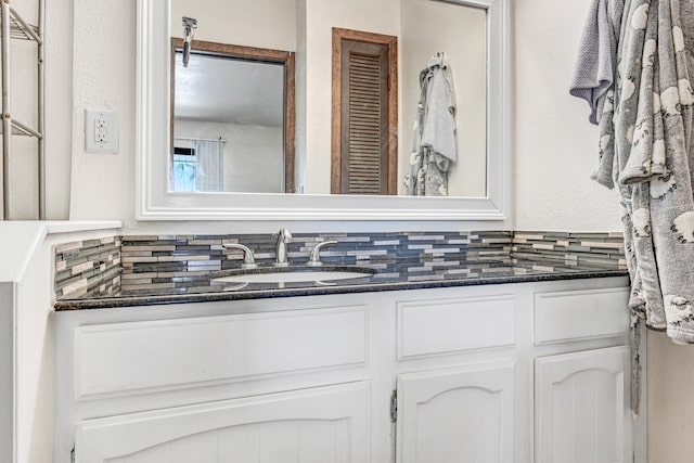 bathroom with backsplash and vanity