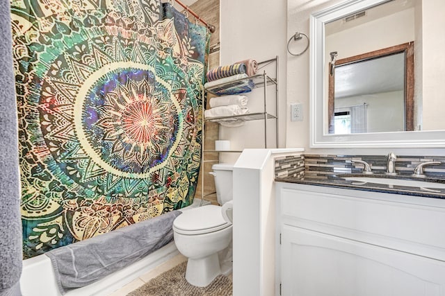 full bathroom featuring tile flooring, oversized vanity, toilet, and shower / bath combo with shower curtain