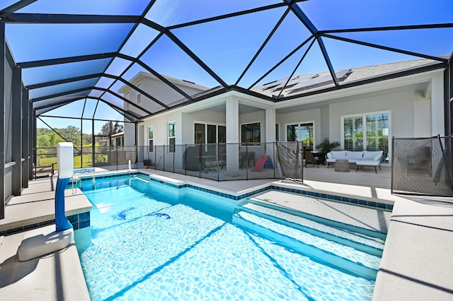 view of swimming pool with a patio, an outdoor living space, and a lanai