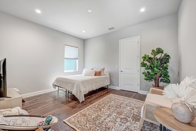 bedroom with hardwood / wood-style floors