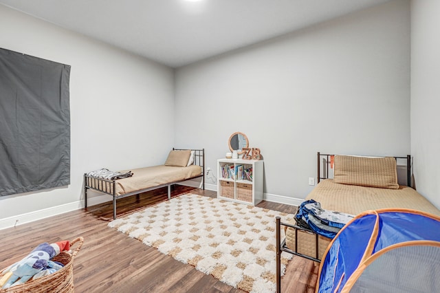 bedroom with hardwood / wood-style flooring