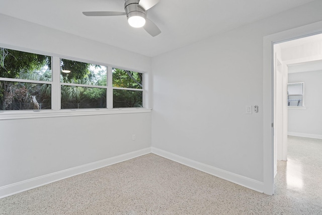 unfurnished room with ceiling fan